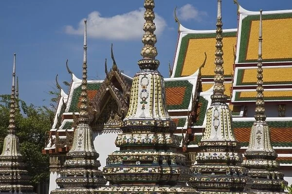 Thailand, Bangkok. The ornately decorated stupas of Wat Pho