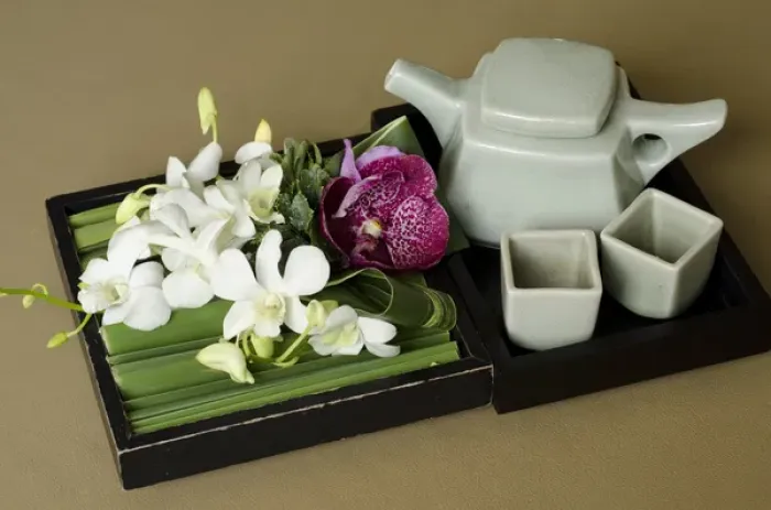 Framed Print : Thailand, Bangkok. Traditional Thai tea pot and cups with orchid arrangement Framed Print : Thailand, Bangkok. Traditional Thai tea pot and cups with orchid arrangement