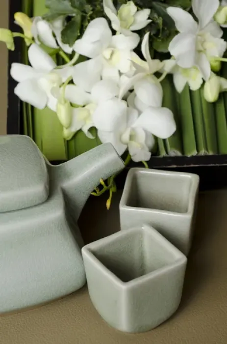 Framed Print : Thailand, Bangkok. Traditional Thai tea pot and cups with orchid arrangement