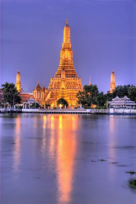 Framed Print : Thailand, Bangkok, Wat Arun. Ornate Buddhist temple reflects in river at dusk. Credit as