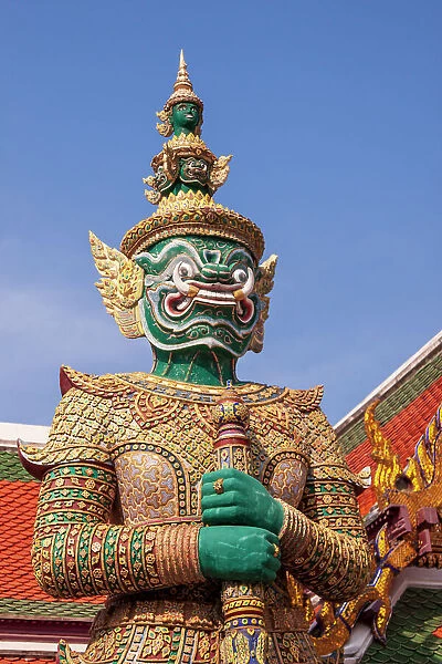 Thailand, Bangkok. Yaksha, demon depicted in the Ramayana, guarding Wat Phra Kaew (Temple of The Emerald Buddha)