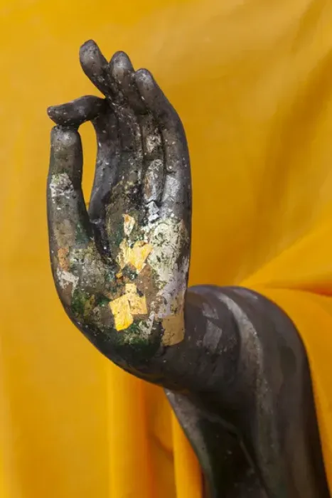 Framed Print : Thailand. Buddha Statue hand with gold leaf tokens