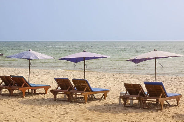 Thailand, Hua Hin. Beach resort town in northern Thailand. Lounge chairs and umbrellas on the beach
