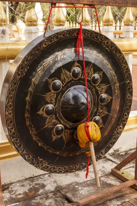 Framed Print : Thailand, Nong Khai. Gong in temple courtyard. Phra That Bang Phuan temple Framed Print : Thailand, Nong Khai. Gong in temple courtyard. Phra That Bang Phuan temple