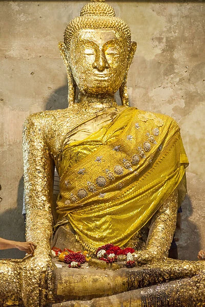 Thailand, Samut Songkhram Province, Amphawa District. Buddha statue covered with gold
