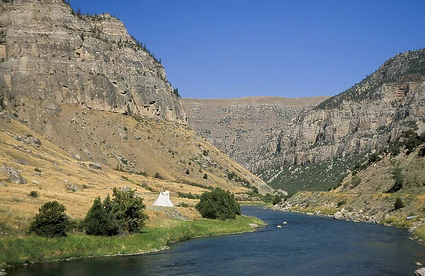Tipi sits on the banks of the Wind River that winds through a steep walled canyon