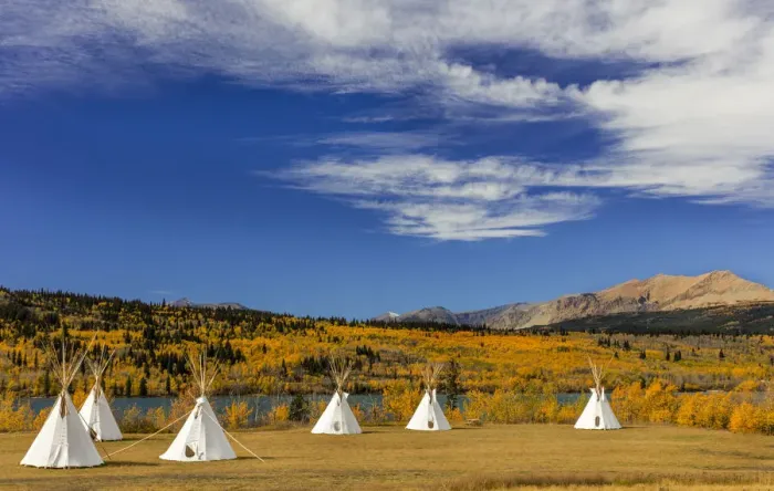 Framed Print : Tipis with Yellow Mountain in background at Chewing Black Bones campground near St Mary Framed Print : Tipis with Yellow Mountain in background at Chewing Black Bones campground near St Mary