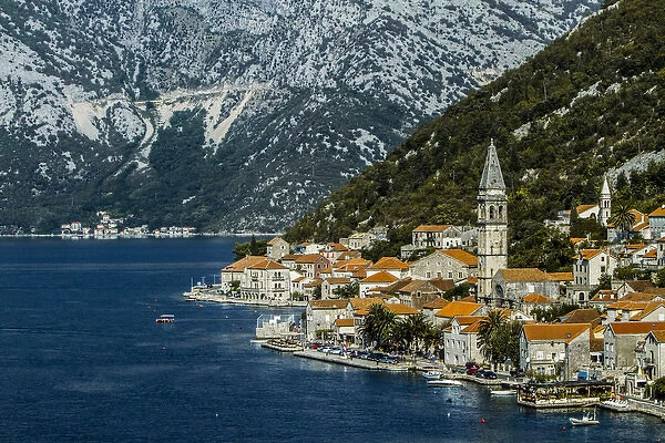 Tivat, Eastern Fjords, Montenegro. Orange tiled roofs, church and a village waterfront