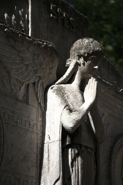 A tomb statue in Cimtiere du Pere Lachaise. Paris. France