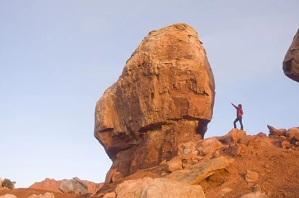 A tourist checks out one of the Twins rock formation in Capitol Reef National Park