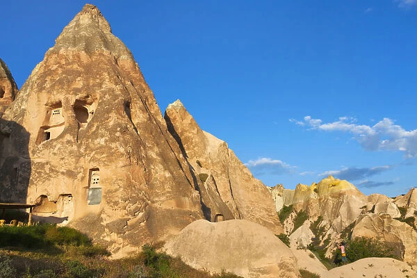 Tourist watching rock formations in the valley, Goreme, Cappadocia, Turkey (UNESCO