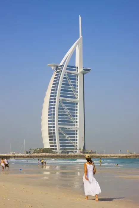 Framed Print : Tourists on the beach with Burj Al Arab Hotel in the distance, Dubai, UAE