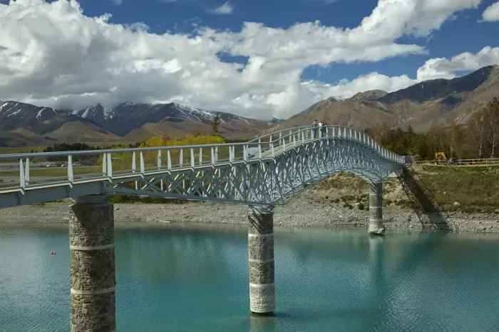 Framed Print : Tourists on pedestrian Bridge over Lake Tekapo outlet, Mackenzie Country, Canterbury Framed Print : Tourists on pedestrian Bridge over Lake Tekapo outlet, Mackenzie Country, Canterbury