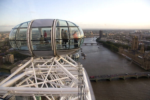 Tourists view the city of London from the London Eye, England