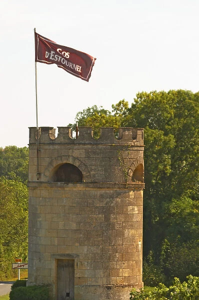 A tower in the vineyard at Chateau Cos d Estournel with a flag with the name