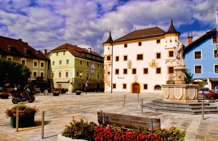 Framed Print : Town square in Mauterndorf Austria with flowers and colorful buildings