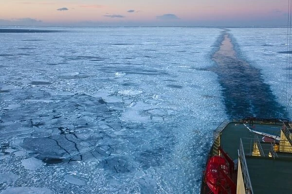 Track left by Icebreaker on the ocean covered with ice floes, Antarctica