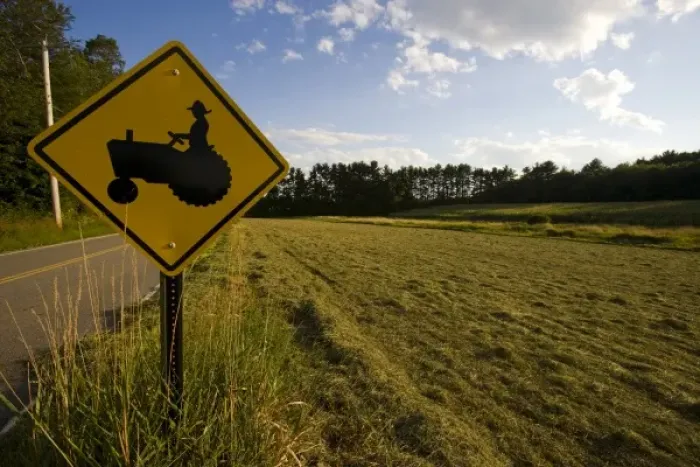 Framed Print : A tractor crossing sign next to a farm in Pepperell, Massachusetts Framed Print : A tractor crossing sign next to a farm in Pepperell, Massachusetts