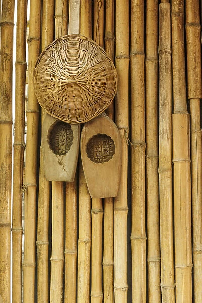 Traditional Chinese woven hat on bamboo wall, Guilin, China