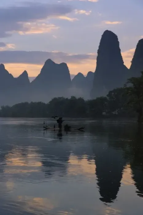 Framed Print : Traditional fisherman with his cormorants on the Li River at sunrise, Guilin, China Framed Print : Traditional fisherman with his cormorants on the Li River at sunrise, Guilin, China