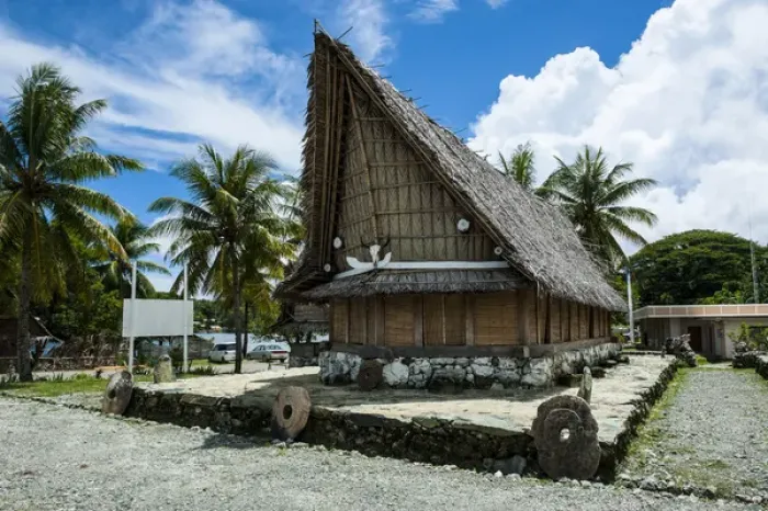 Framed Print : Traditional house with stone money in front, Island of Yap, Micronesia