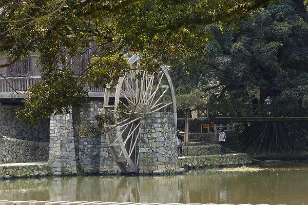 Traditional house and water wheel by the river in Yunshuiyao Village, Nanjing County