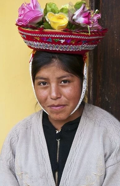 Traditional woman in colorful flower hat; in small town of Pisaq Peru (MR)