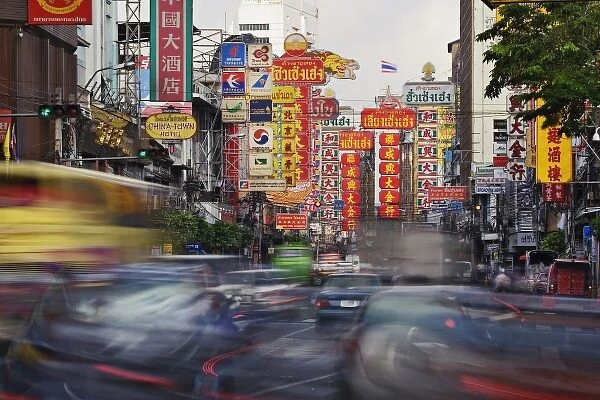 Traffic in motion flowing into Chinatown, Bangkok, Thailand
