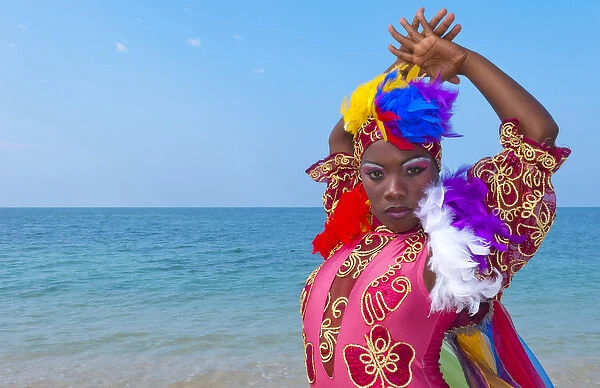 Trinidad Cuba dancers in costume on beautiful beach of ocean with blue water