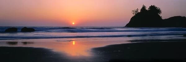 Trinidad State Beach, California. USA. Sea stack & setting sun. Pacific Ocean