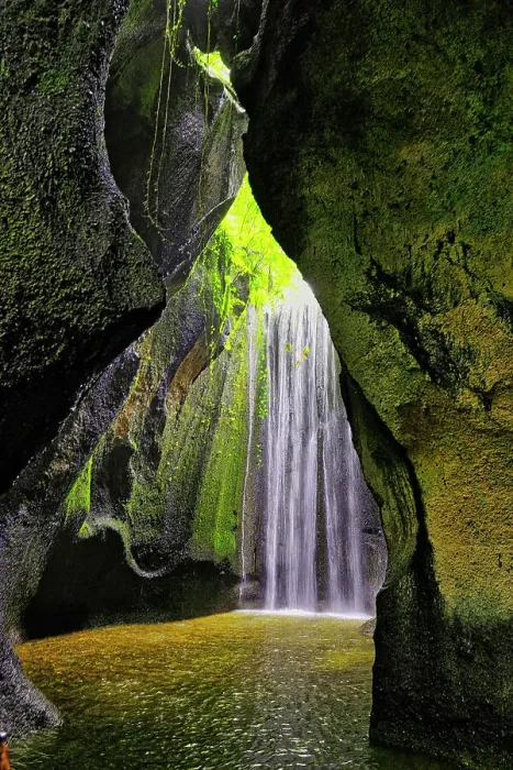 Framed Print : Tukad Cepung Waterfall in the central mountains of Bali, Indonesia. Carved through an underground canyon Framed Print : Tukad Cepung Waterfall in the central mountains of Bali, Indonesia. Carved through an underground canyon