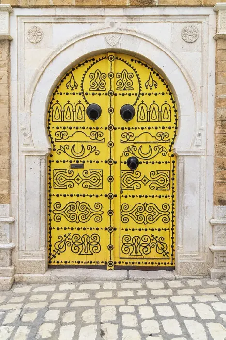 Framed Print : Tunis, Tunisia. A decorated door in a keyhole arch, also known as a Moorish Arch