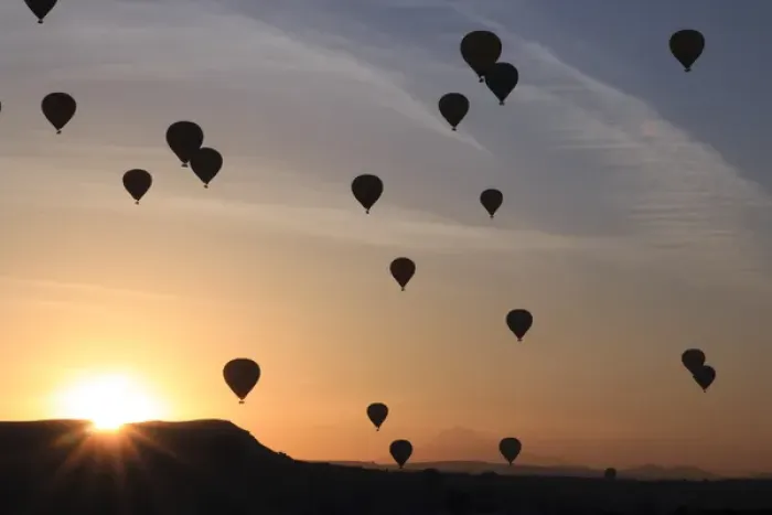 Framed Print : Turkey, Anatolia, Cappadocia, Goreme. Hot air balloons flying above  /  among rock formations