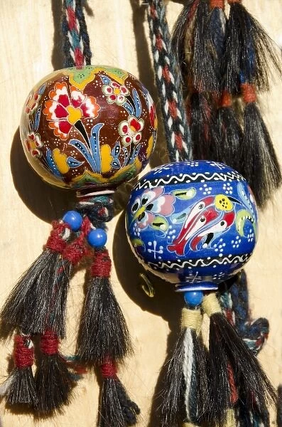 Turkey, Istanbul. Colorful hand painted souvenir pottery globes with horse hair