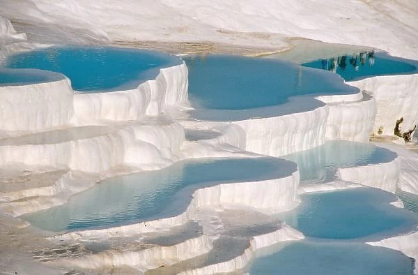 Turkey, Pamukkale (Cotton Castle). Limestone-laden hot springs form white pools with