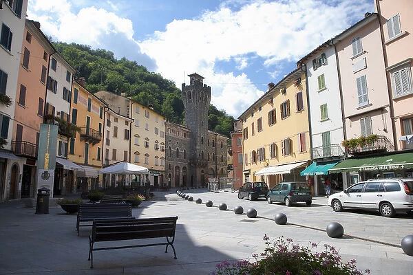 Tuscany, Italy - A pedestrian plaza with park benches amongst city town buildings