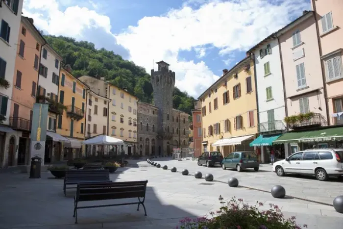 Framed Print : Tuscany, Italy - A pedestrian plaza with park benches amongst city town buildings Framed Print : Tuscany, Italy - A pedestrian plaza with park benches amongst city town buildings