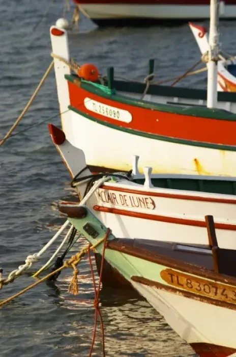 Framed Print : Typical Provencal fishing boats painted in bright colours white, blue, green red yellow Framed Print : Typical Provencal fishing boats painted in bright colours white, blue, green red yellow
