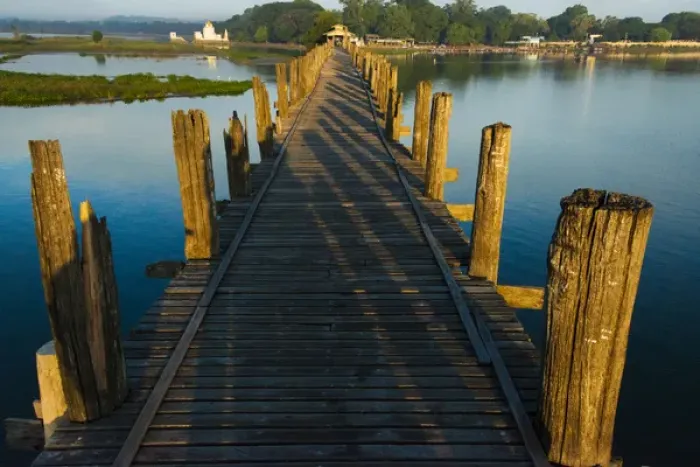 Framed Print : U Bein teak bridge on Taungthaman Lake at sunrise, Citadel Pagoda in the distance