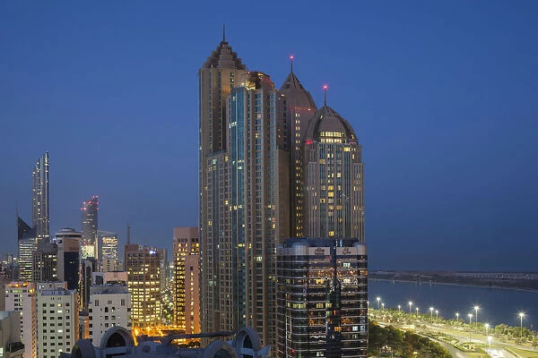 UAE, Abu Dhabi, elevated skyline from Corniche Road East, dawn