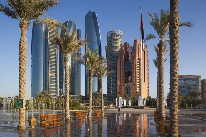 Framed Print : UAE, Abu Dhabi, Etihad Towers and Emirates Palace Hotel fountains, dusk
