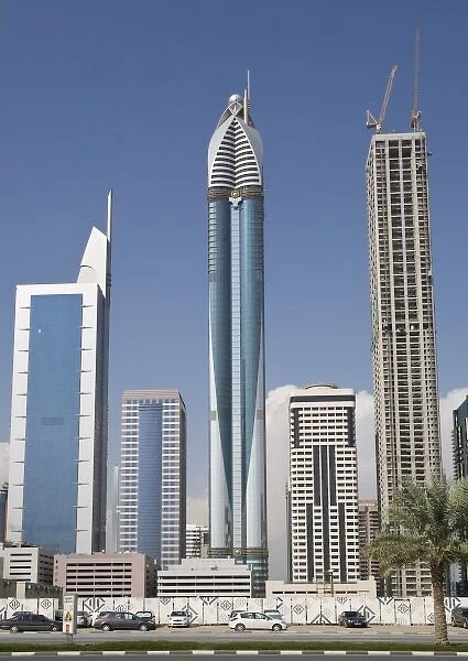 UAE, Dubai. Rose Tower and 21st Century Tower along Sheik Zayed Road