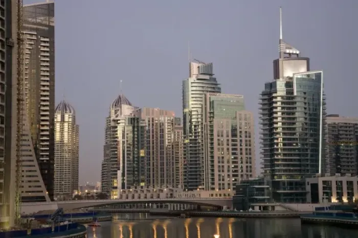 Framed Print : UAE, Dubai. Tower lights reflect on marina water at night