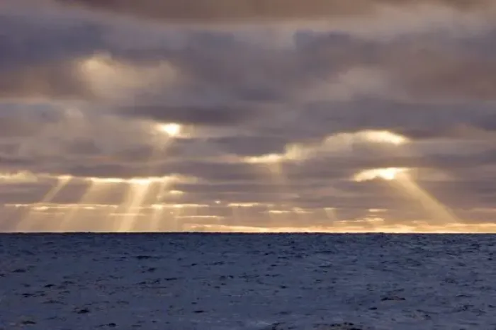 Framed Print : UK Territory, South Georgia Island, Scotia Sea. God rays pierce stormy clouds above ocean
