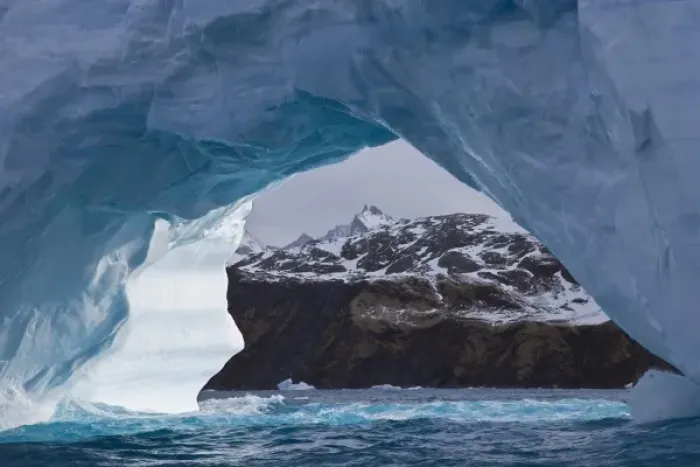 Framed Print : UK Territory, South Georgia Island, Iris Bay. Brown land framed by iceberg arch Framed Print : UK Territory, South Georgia Island, Iris Bay. Brown land framed by iceberg arch