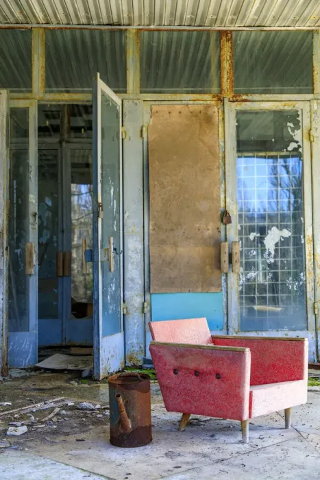 Framed Print : Ukraine, Pripyat, Chernobyl. A coral-colored modernist chair sits outside an abandoned Framed Print : Ukraine, Pripyat, Chernobyl. A coral-colored modernist chair sits outside an abandoned
