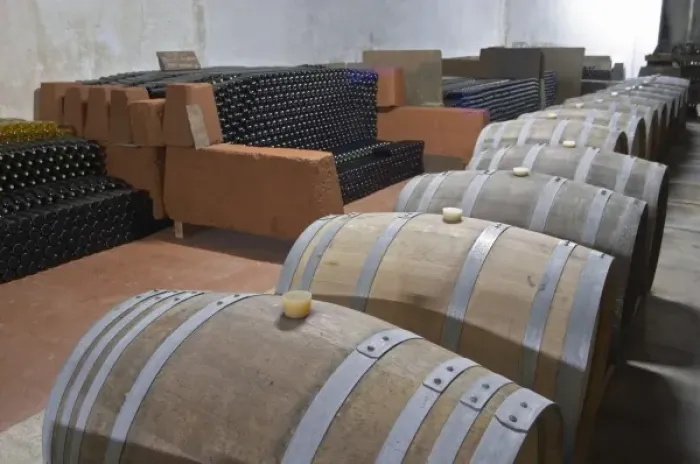 Framed Print : The underground ageing cellar with thousands of bottles and oak barrels for aging the wine Framed Print : The underground ageing cellar with thousands of bottles and oak barrels for aging the wine