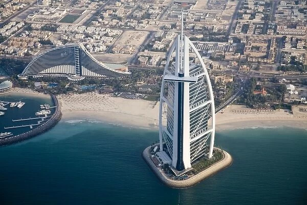 United Arab Emirates, Dubai. Aerial of Burj al Arab and Jumeirah Beach Hotels, looking inland