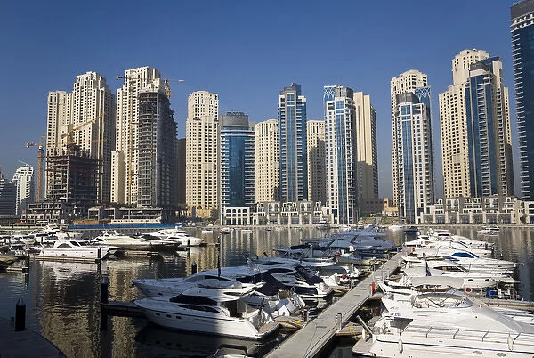 United Arab Emirates, Dubai. Marina towers with boats at anchor