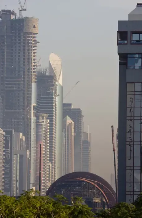 Framed Print : United Arab Emirates, Dubai. Metro station under construction, with buildings of